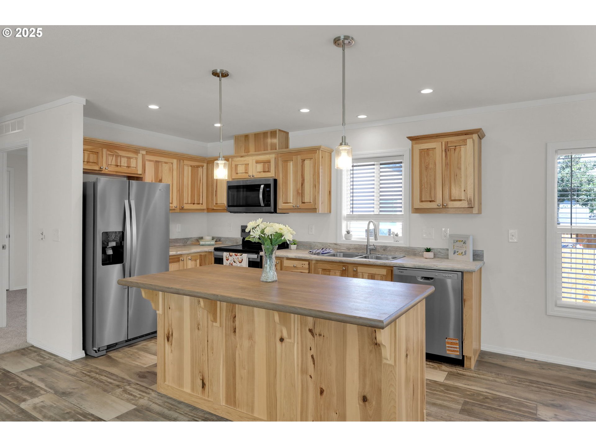 498 Moffit Lane Springfield, OR 97477 - Photo 7 of 24 a kitchen with kitchen island granite countertop a sink appliances and a counter top space
