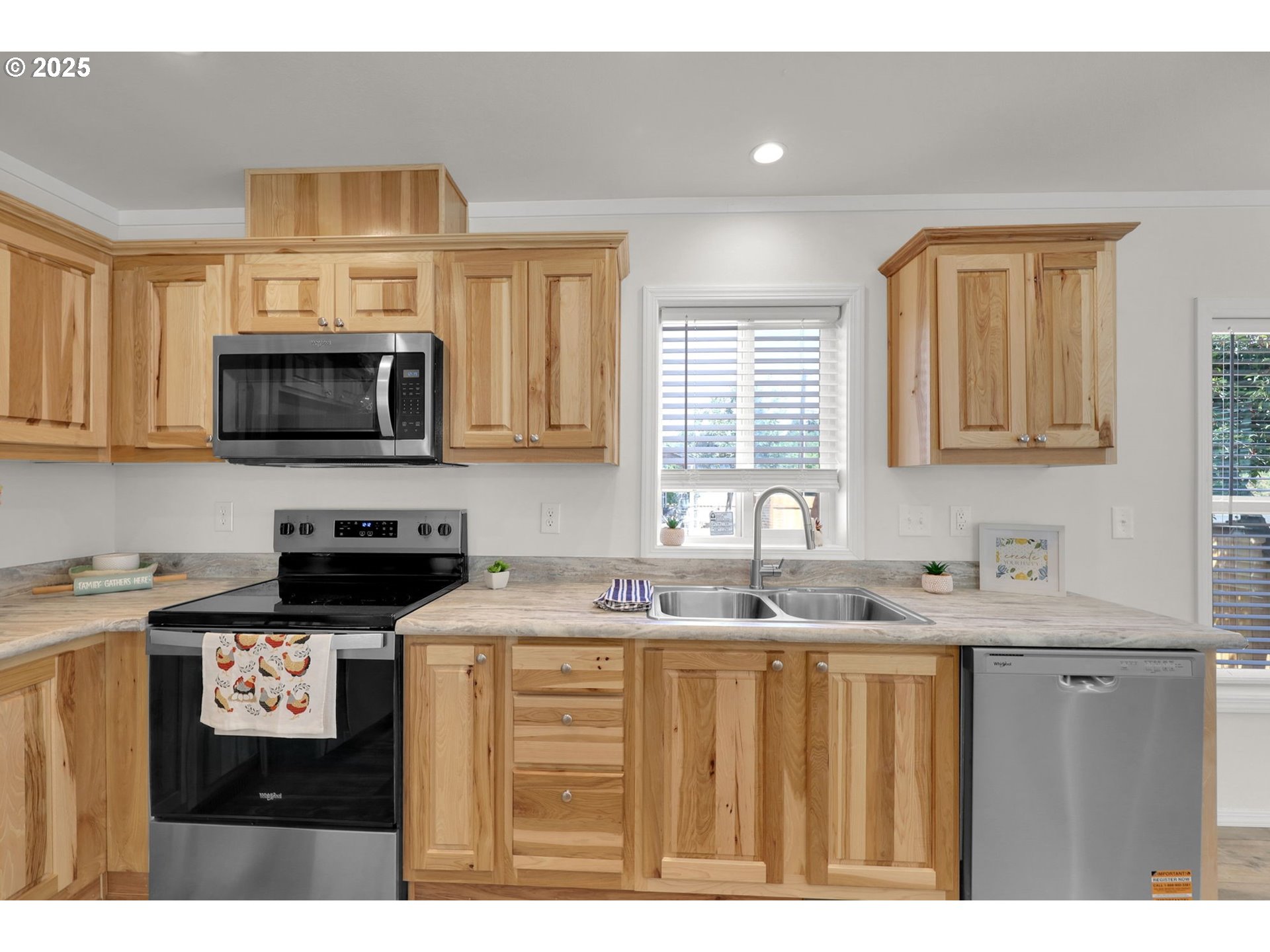 498 Moffit Lane Springfield, OR 97477 - Photo 8 of 24 a kitchen with granite countertop a sink a stove a microwave a counter space and cabinets