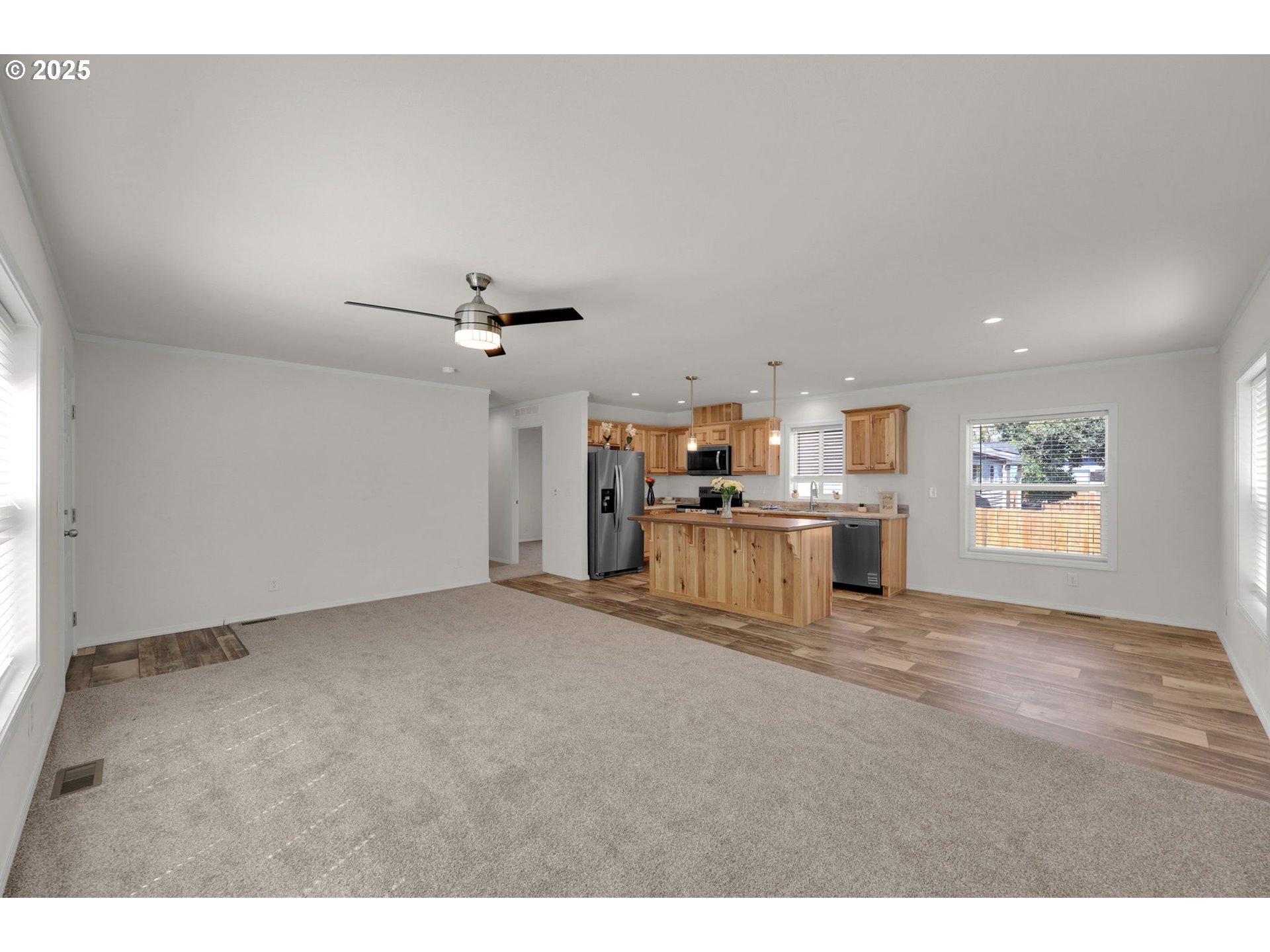 498 Moffit Lane Springfield, OR 97477 - Photo 9 of 24 a view of a kitchen with a sink and a refrigerator