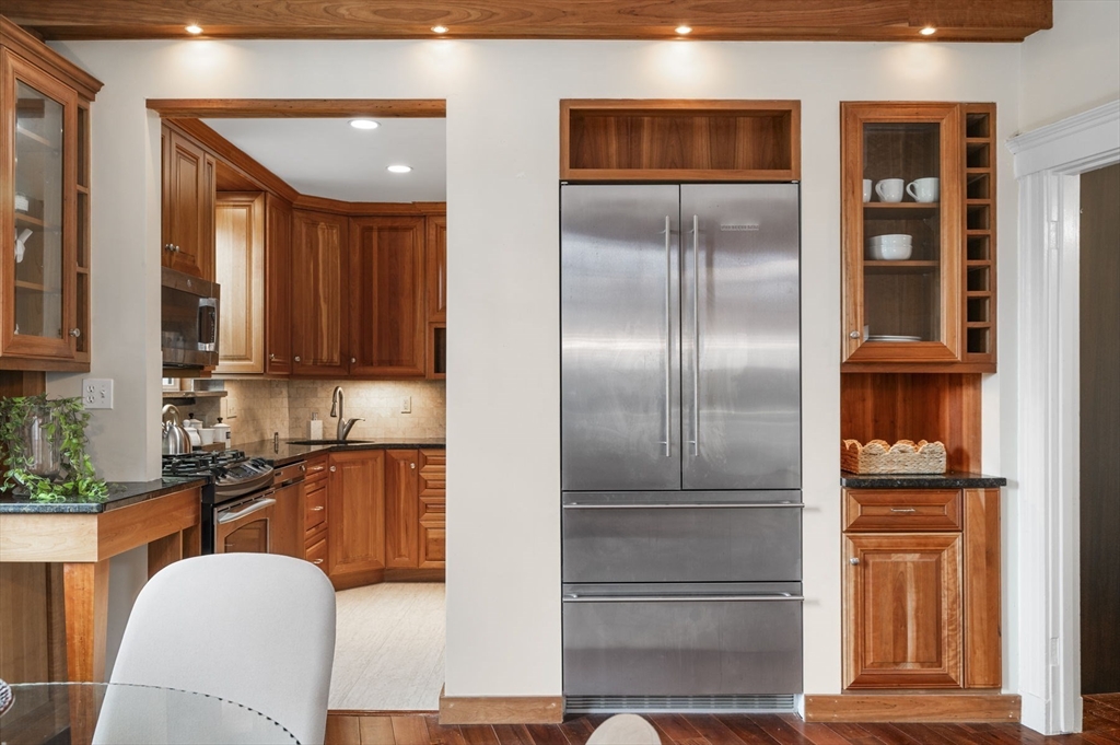 34 Garrison Road, Unit 2 Brookline, MA 02445 - Photo 11 of 21 a kitchen with stainless steel appliances granite countertop a refrigerator and a sink