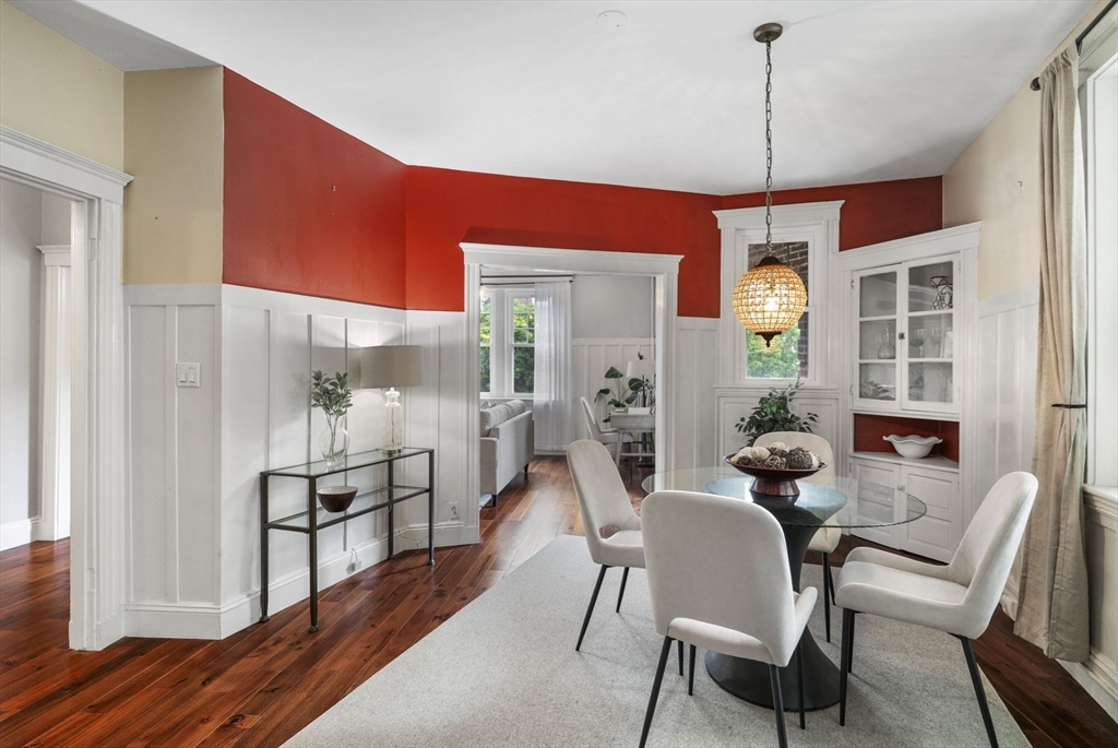 34 Garrison Road, Unit 2 Brookline, MA 02445 - Photo 13 of 21 a dining room with furniture a chandelier and wooden floor