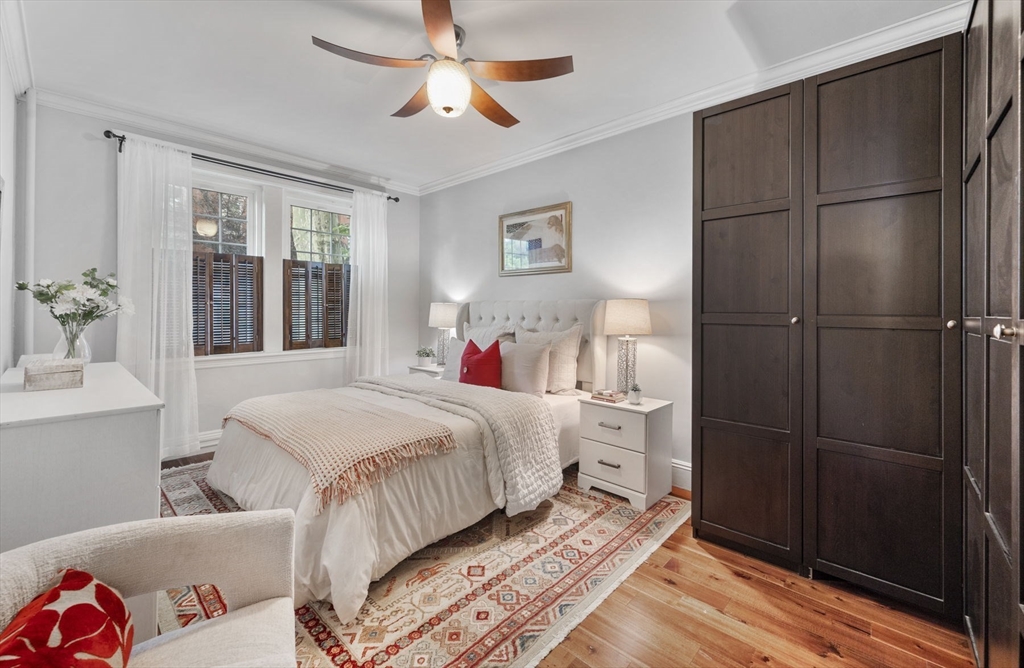 34 Garrison Road, Unit 2 Brookline, MA 02445 - Photo 16 of 21 a bedroom with a bed and a chandelier