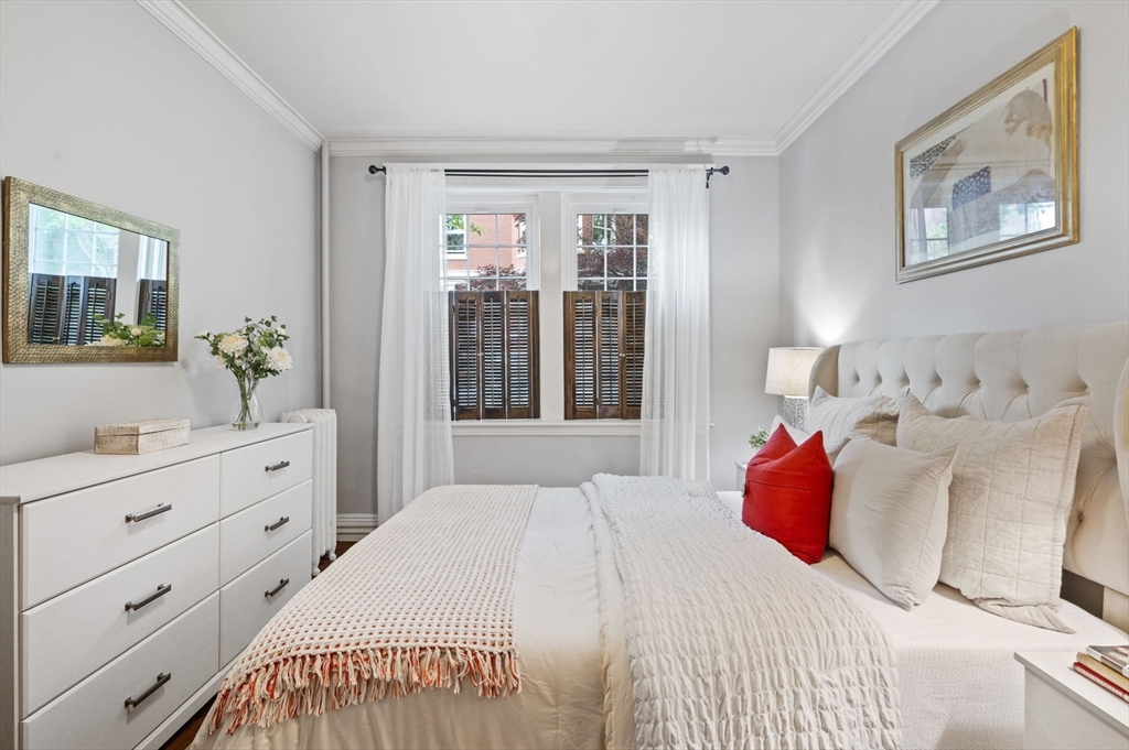 34 Garrison Road, Unit 2 Brookline, MA 02445 - Photo 17 of 21 a bedroom with a bed and a window