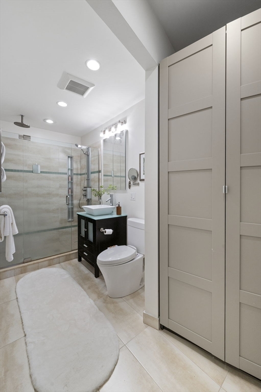 34 Garrison Road, Unit 2 Brookline, MA 02445 - Photo 18 of 21 a bathroom with a sink and a mirror