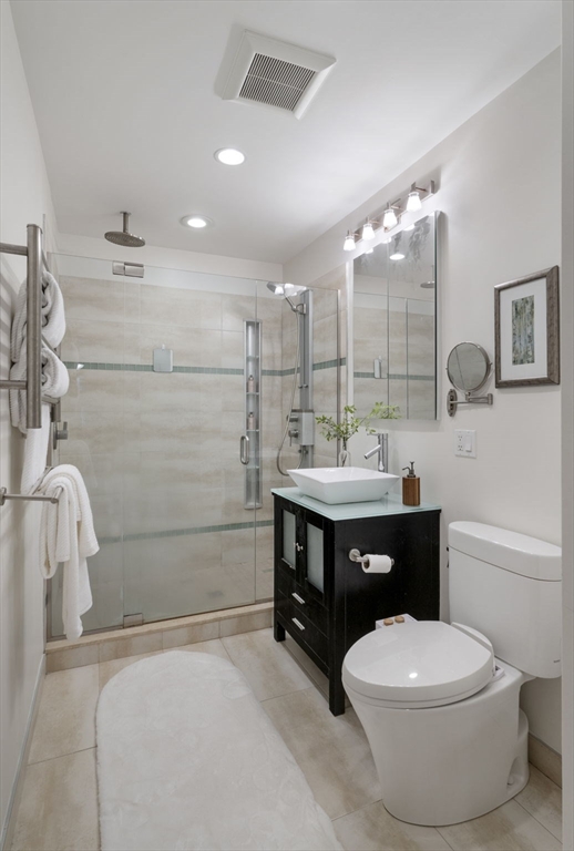 34 Garrison Road, Unit 2 Brookline, MA 02445 - Photo 19 of 21 a bathroom with a sink a toilet and shower