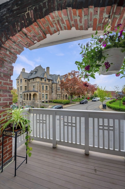 34 Garrison Road, Unit 2 Brookline, MA 02445 - Photo 9 of 21 a view of a chairs on the roof deck