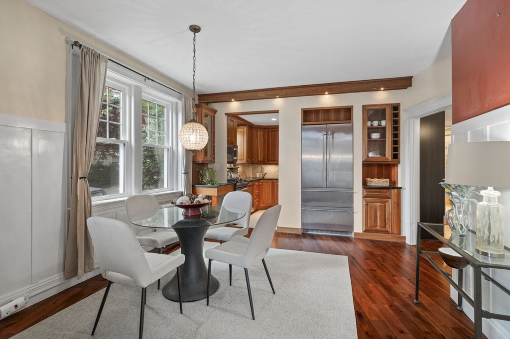 34 Garrison Road, Unit 2 Brookline, MA 02445 - Photo 10 of 21 a dining room with furniture a chandelier and wooden floor
