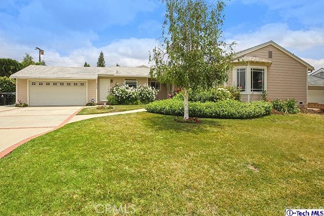 10902 Garden Grove Avenue Porter Ranch, CA 91326 - Photo 1 of 1 a view of a house with a yard and plants