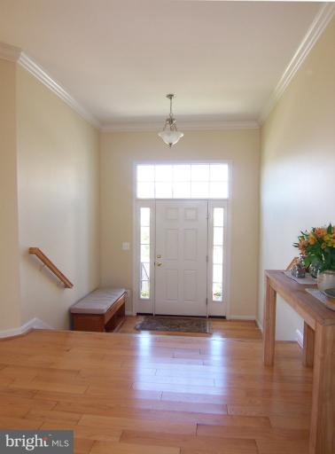 6613 Pebble Brooke Road Baltimore, MD 21209 - Photo 1 of 28 Light filled entry foyer with hardwood floor
