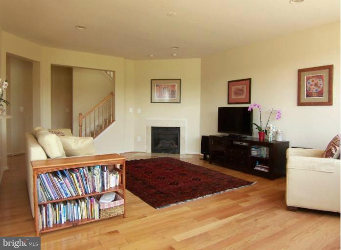 6613 Pebble Brooke Road Baltimore, MD 21209 - Photo 23 of 28 Family room with gleaming hardwood floor