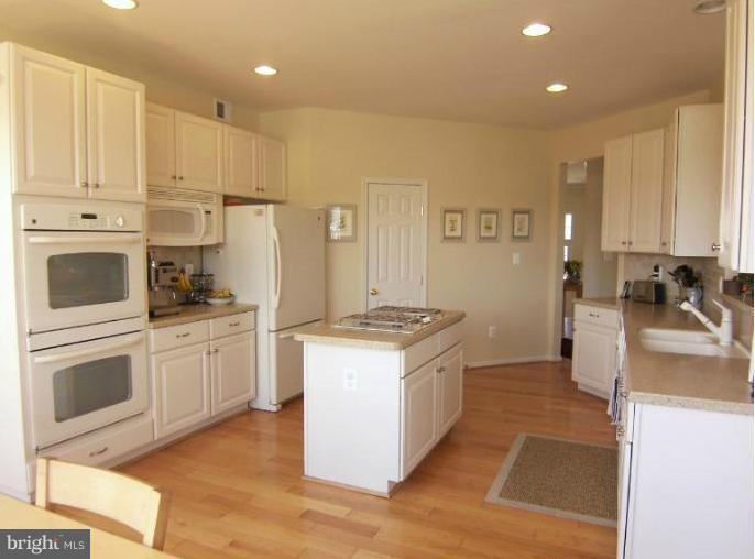 6613 Pebble Brooke Road Baltimore, MD 21209 - Photo 24 of 28 Spacious kitchen with beautiful hardwood floor