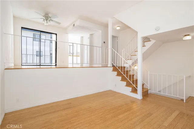 a view of an entryway with wooden floor