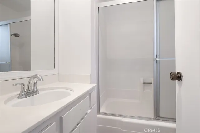 a bathroom with a sink and a shower