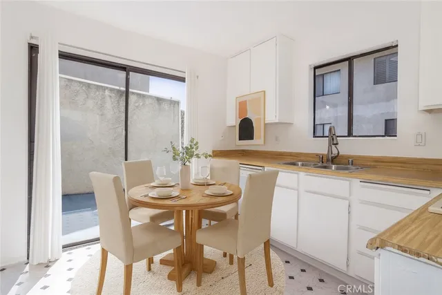 a view of a dining room with furniture and window