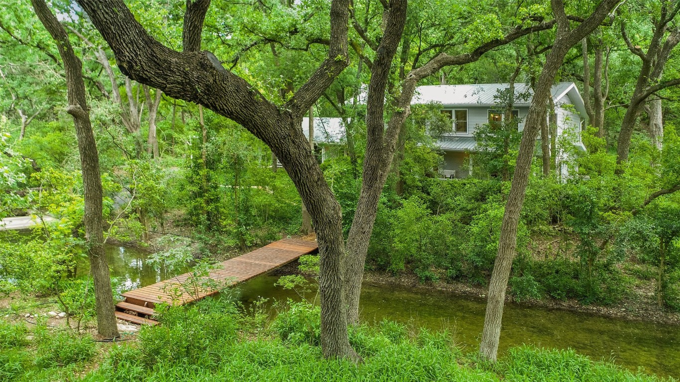 Charming footbridge to the 1st of two homesites on this ultra-private property. Surrounded on three sides by permanently protected nature preserves.