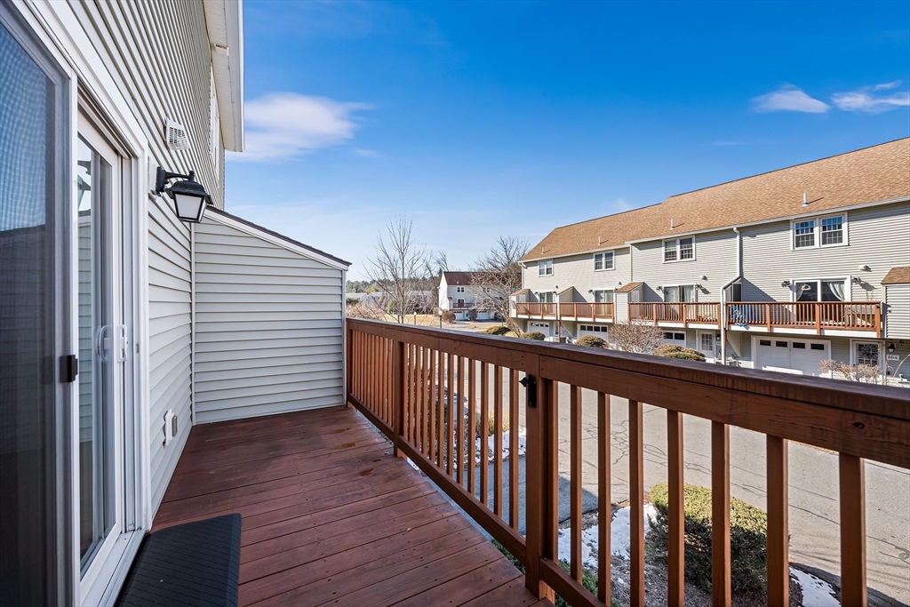 176 Patrick Road, Unit 176 Tewksbury, MA 01876 - Photo 16 of 42 a view of city from a balcony
