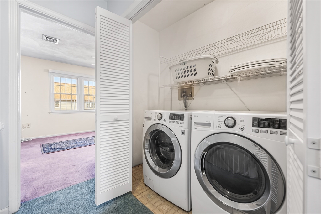 176 Patrick Road, Unit 176 Tewksbury, MA 01876 - Photo 29 of 42 a utility room with dryer and washer