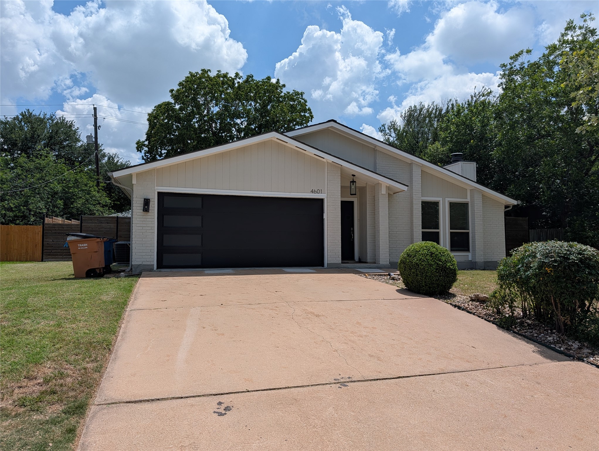 4601 Tamarack Trail Austin, TX 78727 - Photo 1 of 19 Modern facade with sleek garage door and inviting entry.