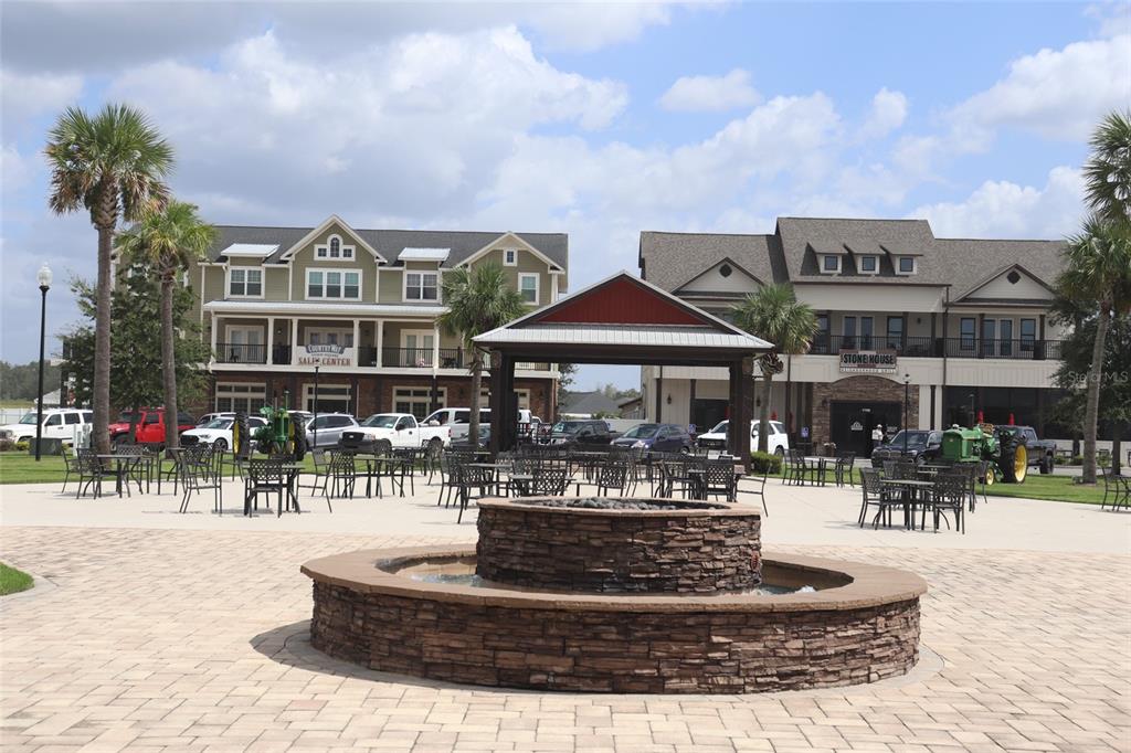 24313 Southwest 17th Lane Newberry, FL 32669 - Photo 11 of 15 a front view of a building with outdoor seating