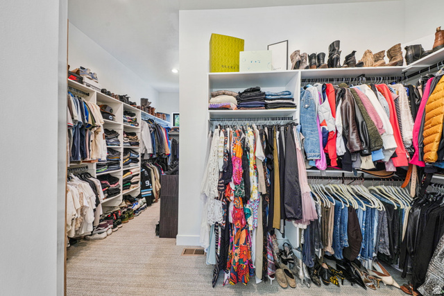 3667 Little Cottonwood Road, Unit 1 Sandy, UT 84092 - Photo 21 of 49 Custom closet system featuring extensive shelving, multiple hanging rods, and integrated storage solutions