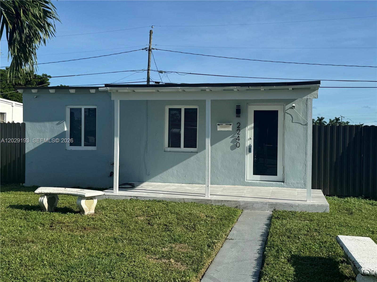 2240 Rutland Street Opa-Locka, FL 33054 - Photo 11 of 11 a view of a porch with a yard
