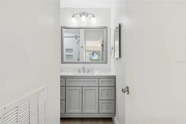 an empty room with closet and a ceiling fan