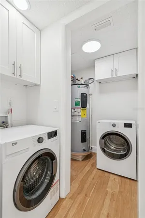 an aerial view of a residential houses with outdoor space and swimming pool