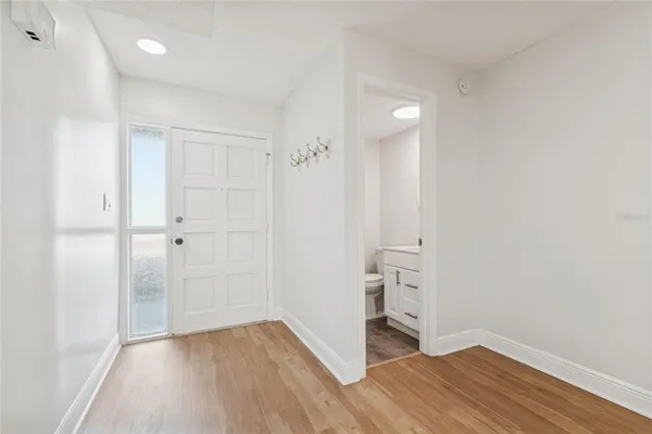 a kitchen with a sink stove and refrigerator