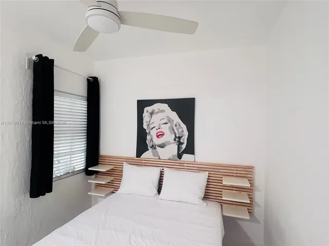 a view of a hallway with paintings on the wall