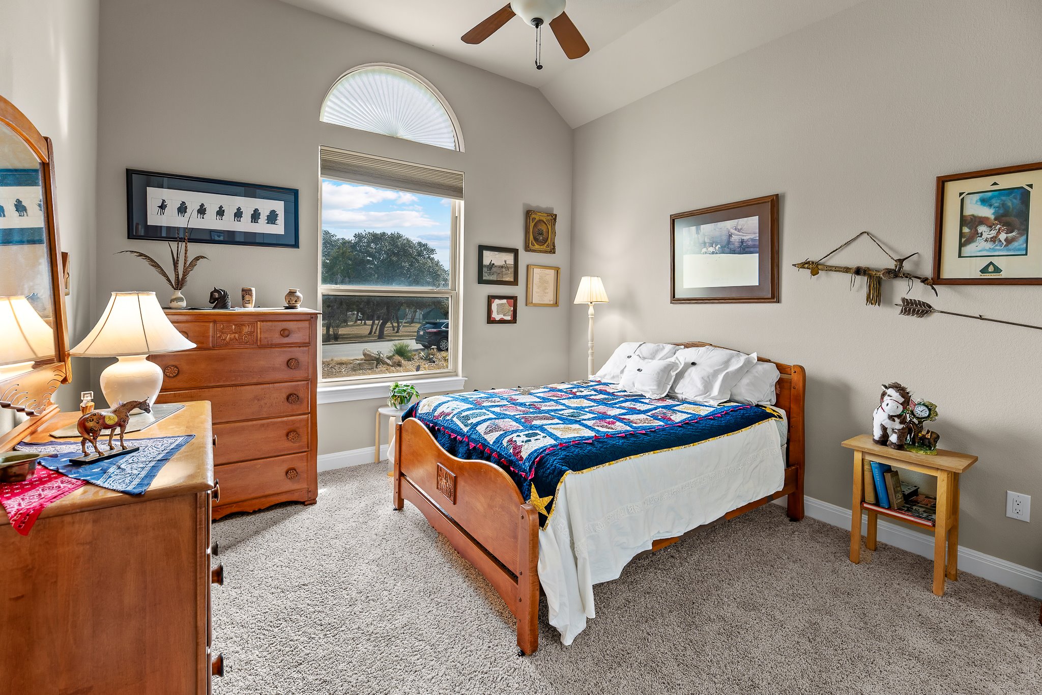 204 Venture Boulevard South Point Venture, TX 78645 - Photo 21 of 40 a bedroom with a bed and a window