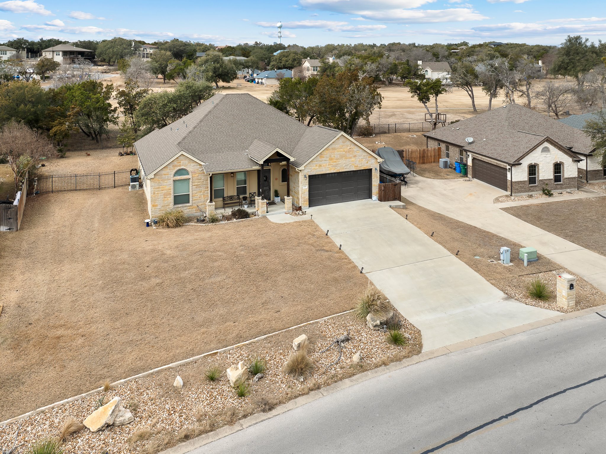 204 Venture Boulevard South Point Venture, TX 78645 - Photo 3 of 40 a view of a white house with a ocean view