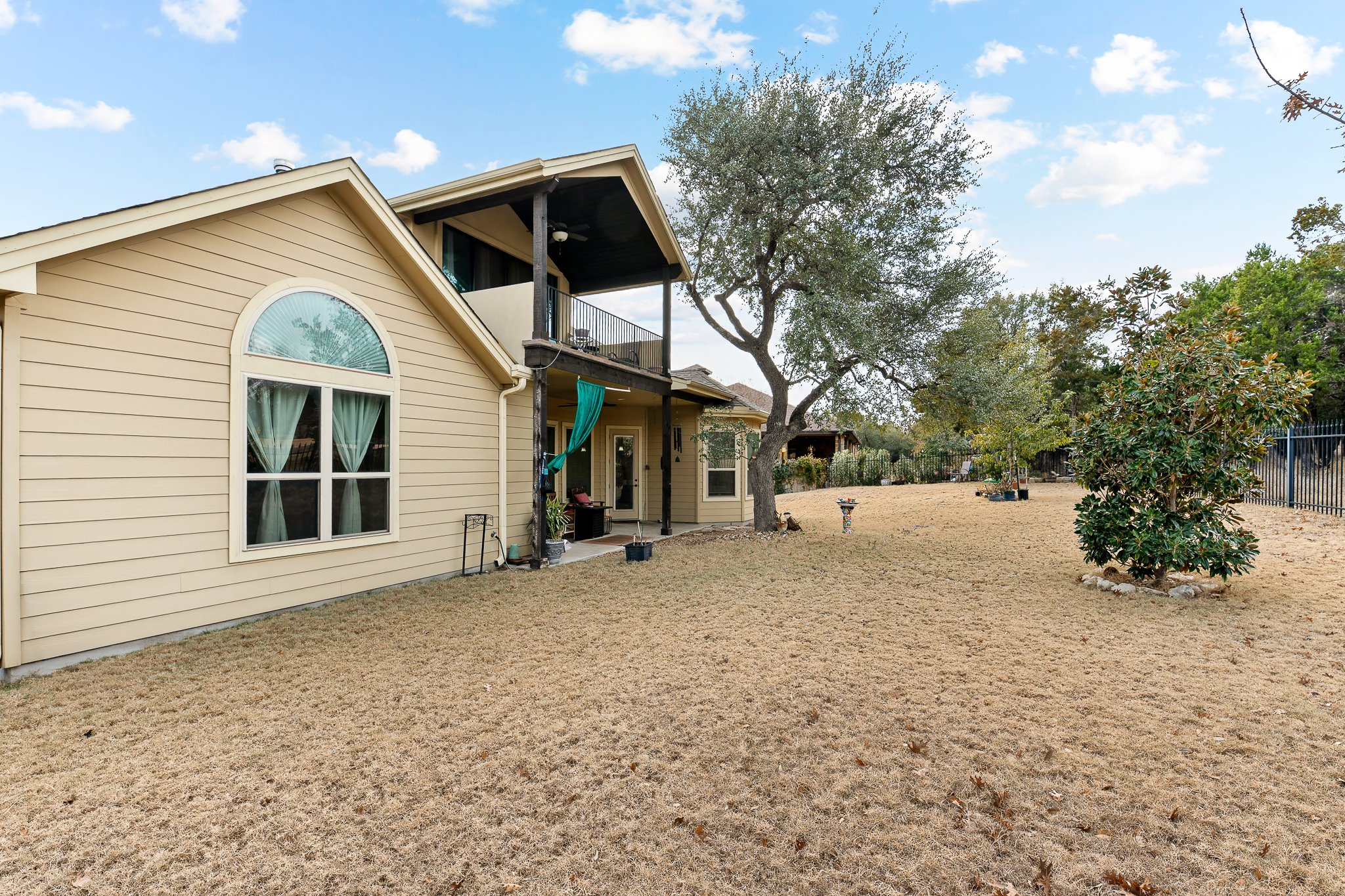 204 Venture Boulevard South Point Venture, TX 78645 - Photo 32 of 40 a view of a house with a yard and garage