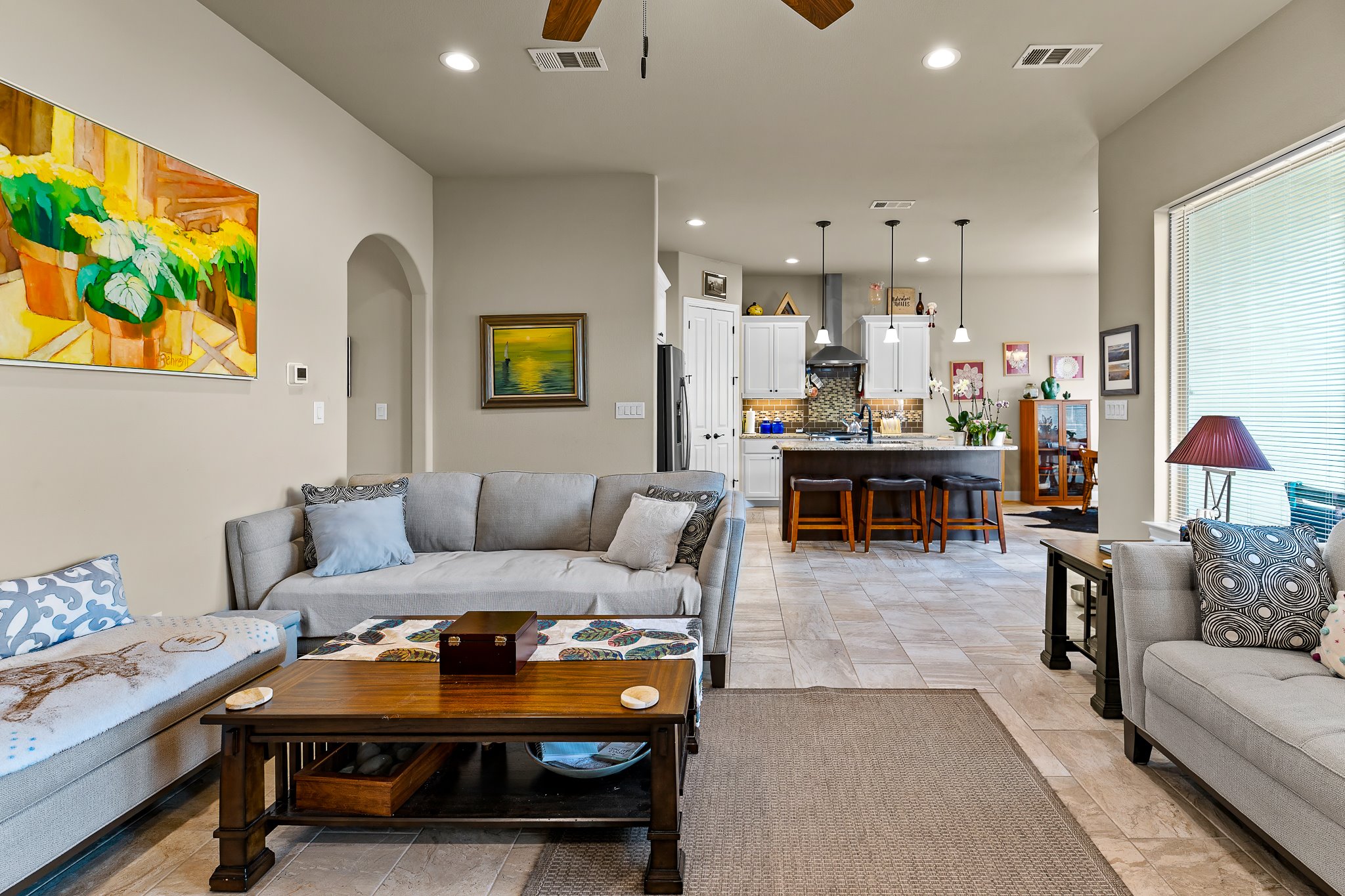 204 Venture Boulevard South Point Venture, TX 78645 - Photo 8 of 40 a living room with furniture and painting on the wall
