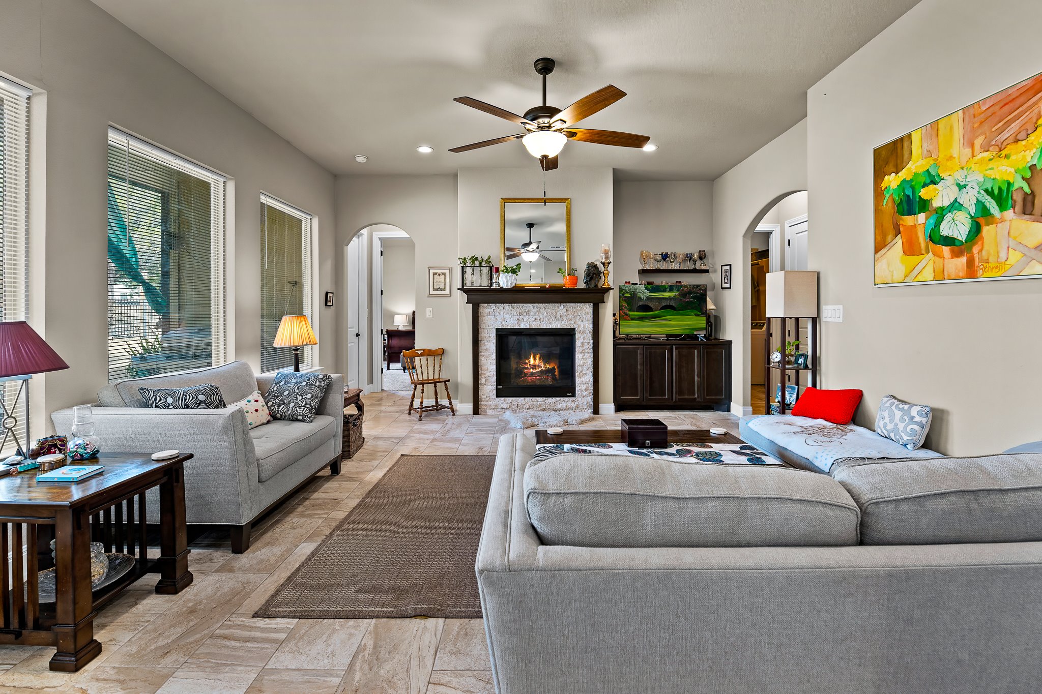 204 Venture Boulevard South Point Venture, TX 78645 - Photo 9 of 40 a living room with furniture a fireplace and a flat screen tv