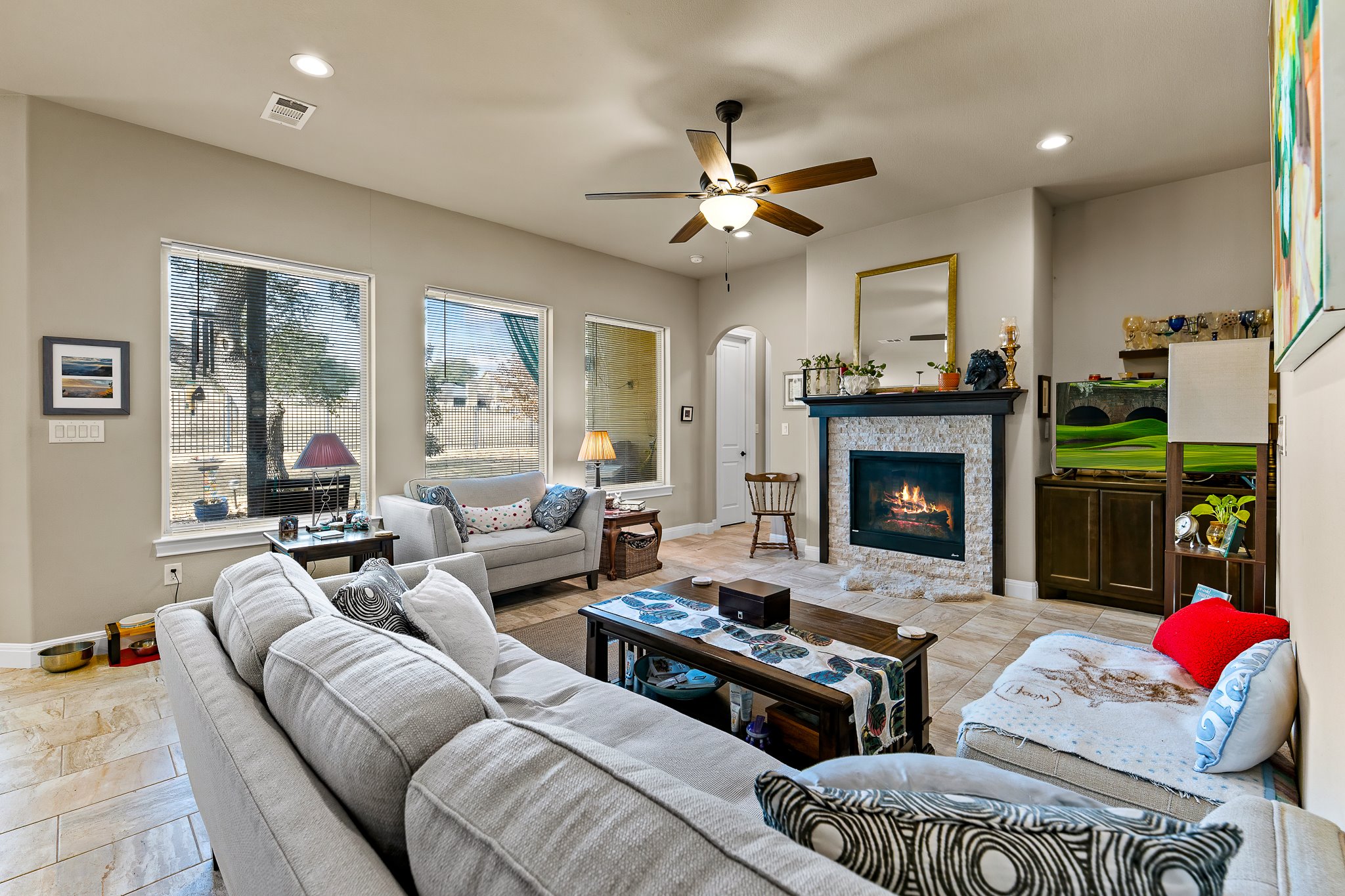 204 Venture Boulevard South Point Venture, TX 78645 - Photo 10 of 40 a living room with furniture and a fireplace