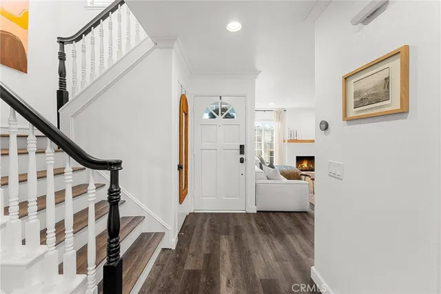 a living room with furniture fireplace and flat screen tv