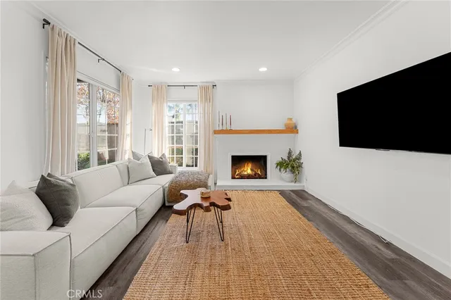 a living room with furniture and flowers