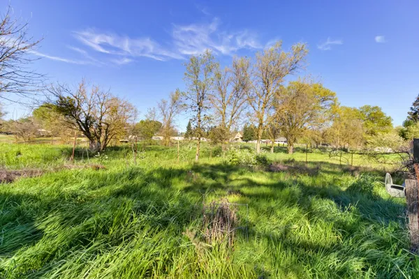a view of a backyard with mountain view