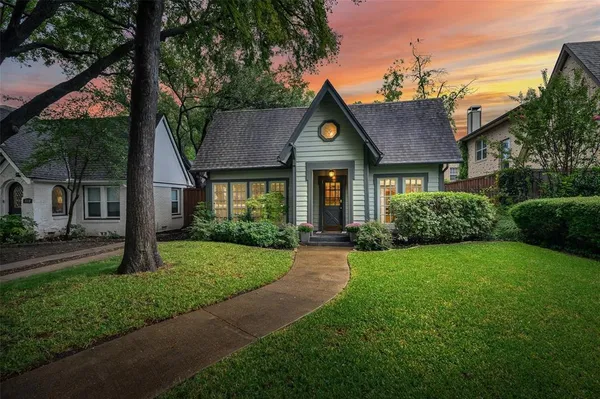 a front view of a house with yard