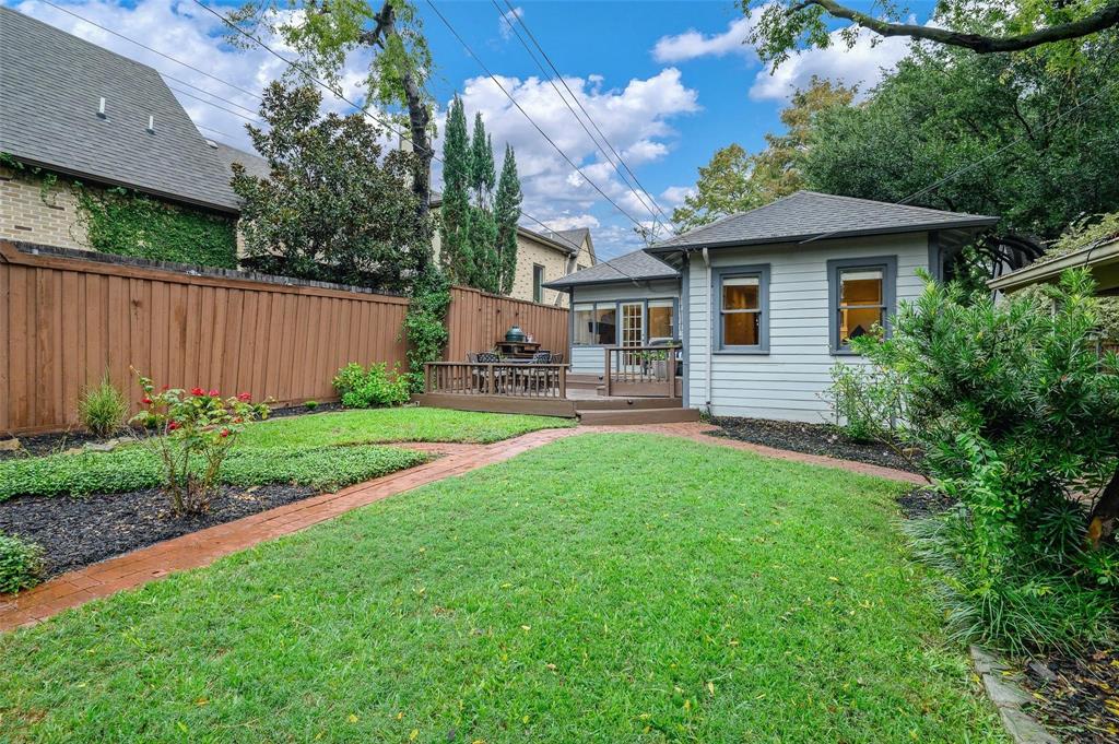 5506 Ridgedale Avenue Dallas, TX 75206 - Photo 13 of 16 a front view of house with yard and green space