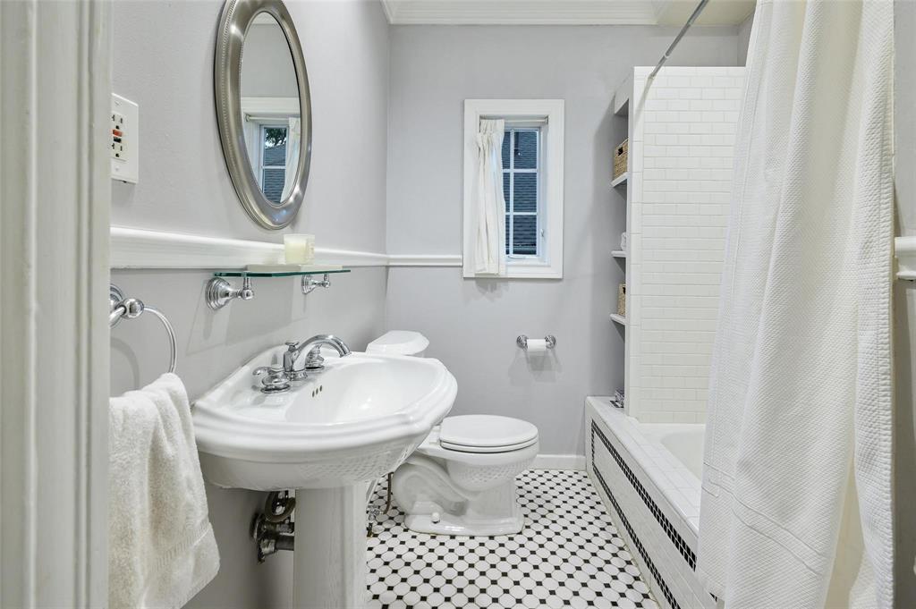 5506 Ridgedale Avenue Dallas, TX 75206 - Photo 16 of 16 a bathroom with a sink toilet and a mirror