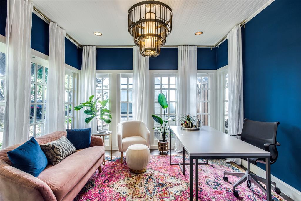 5506 Ridgedale Avenue Dallas, TX 75206 - Photo 3 of 16 a living room with furniture a chandelier and a potted plant