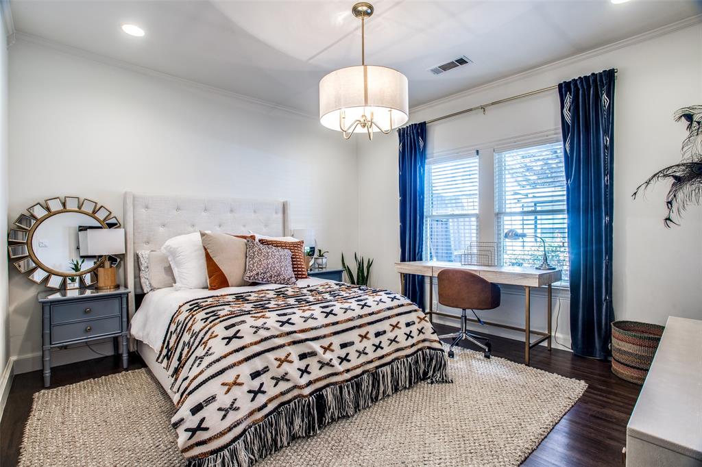 5506 Ridgedale Avenue Dallas, TX 75206 - Photo 9 of 16 a bedroom with a bed and wooden floor