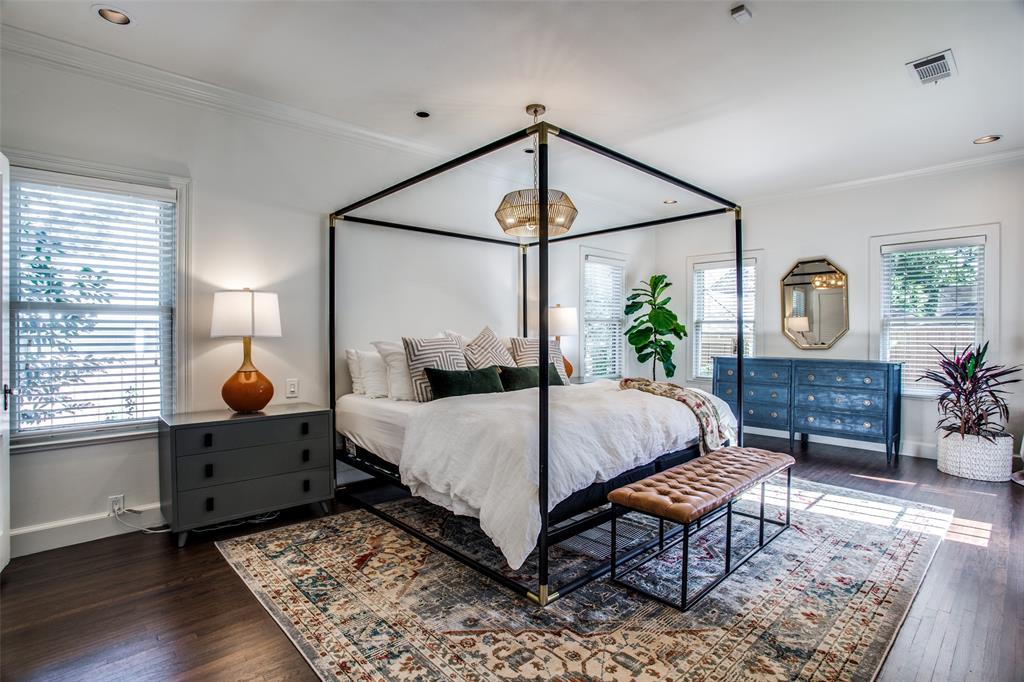 5506 Ridgedale Avenue Dallas, TX 75206 - Photo 10 of 16 a bedroom with a bed a mirror on dresser and a window