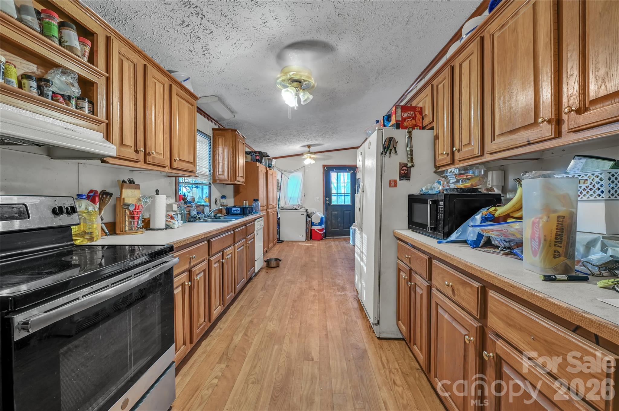 2571 Major Evans Road Lancaster, SC 29720 - Photo 5 of 19 a kitchen with stainless steel appliances granite countertop lots of counter top space and cabinets