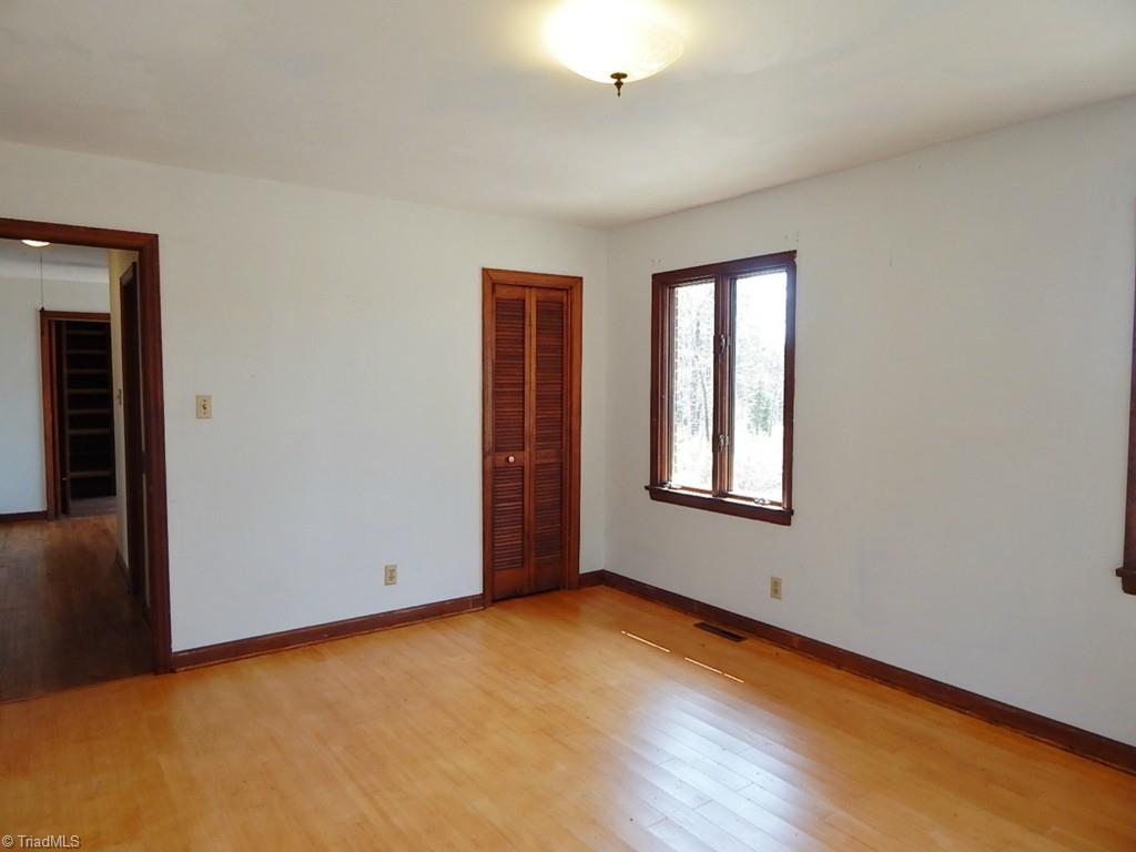 5736 Bunch Road Oak Ridge, NC 27310 - Photo 16 of 30 2nd bedroom with bamboo floor