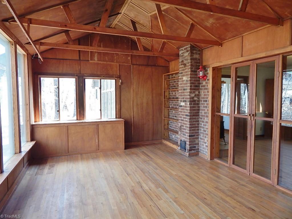 5736 Bunch Road Oak Ridge, NC 27310 - Photo 21 of 30 Sunroom with open beams