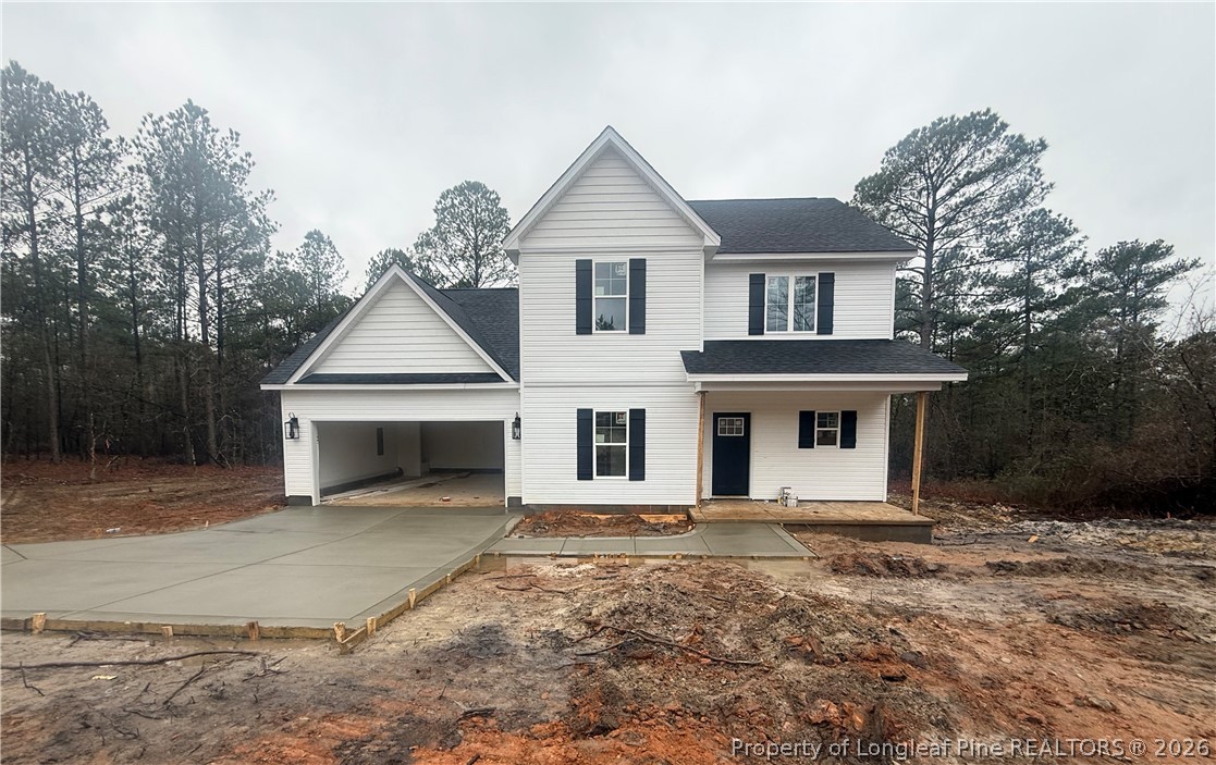 421 Needmore Road Cameron, NC 28326 - Photo 2 of 12 a front view of a house with yard