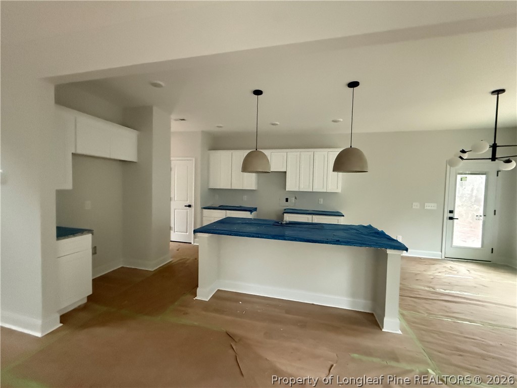 421 Needmore Road Cameron, NC 28326 - Photo 4 of 12 a kitchen with stainless steel appliances granite countertop a sink a stove and a wooden floors