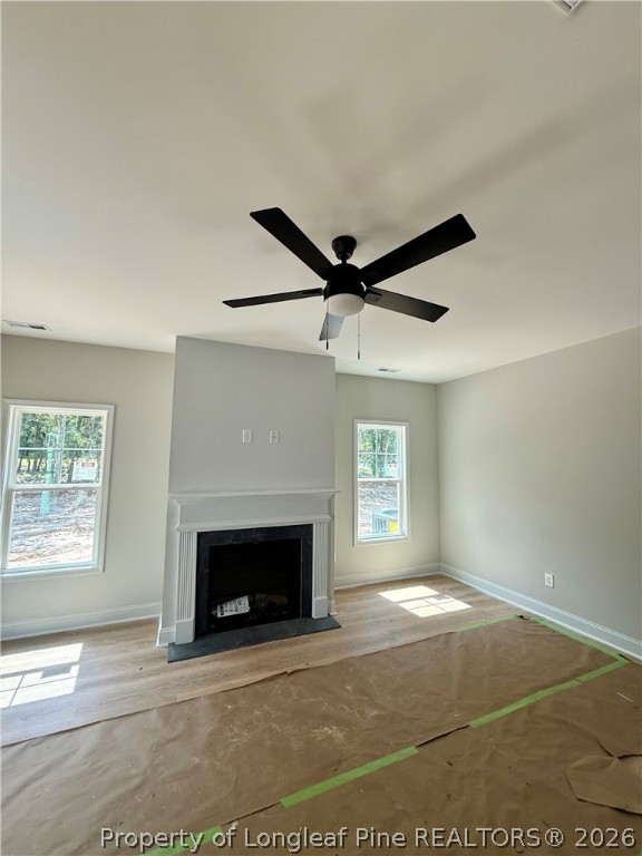 421 Needmore Road Cameron, NC 28326 - Photo 10 of 12 a view of an empty room with window and fireplace
